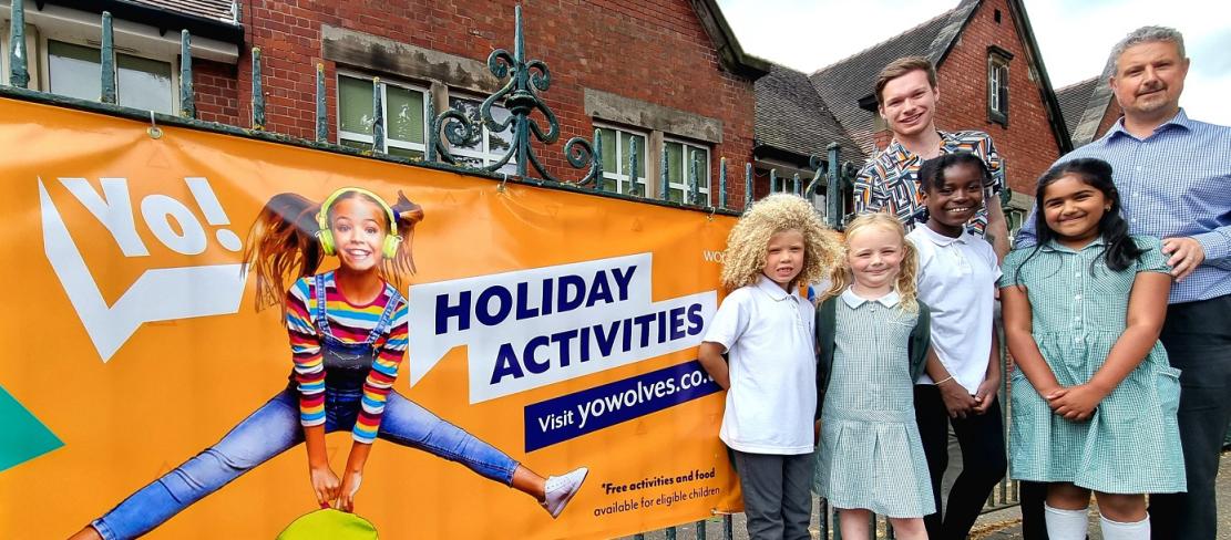 From left to right, Councillor Chris Burden, Cabinet Member for Education, Skills and Work, Philip Salisbury, Headteacher at Woodfield Primary School in Penn, and pupils celebrate the launch of this year’s Yo! Summer activity programme.